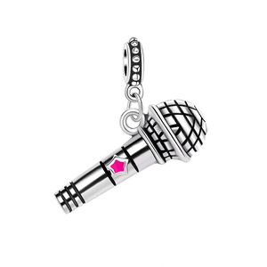 Macro shot of silver microphone pendant with pink star detail for DIY bracelets