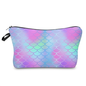 Detail of multi-color mermaid scale pattern and black zipper on fabric makeup bag