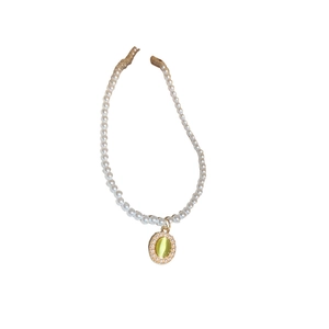 Vintage pearl necklace featuring a yellow oval tulip pendant with a beaded border
