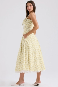 Detail of floral midi dress featuring delicate lace hem and high-quality woven fabric