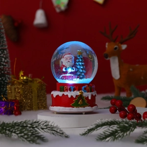 Macro detail of Christmas snow globe showing Santa miniature and blue LED glowing light