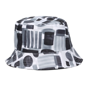 Outdoor bucket hat with black and white abstract geometric ink print on white background