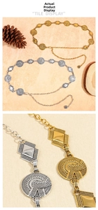 Detail of vintage metal waist chains in gold and silver with rhombic textures and charms