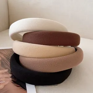 Detailed set of 5 wide padded sponge headbands in neutral colors with textured fabric