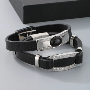Detailed macro of 316L stainless steel clasp and twin-layer leather texture on a bracelet