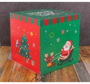 Detailed view of large Christmas gift box with festive Santa and penguin illustrations