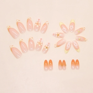 Detail of 3D pearl flowers and starfish charms on almond-shaped orange gradient press-on nails