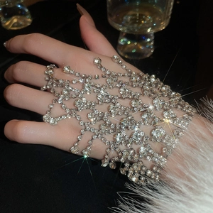 Elegant silver mesh hand chain with sparkling diamond tassels for a luxury women's look