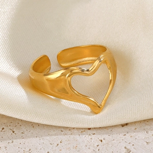 Minimalist gold heart-shaped open ring made of stainless steel on a soft silk base