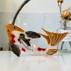Elegant koi fish acetate hair claw clip with orange and white marbled pattern