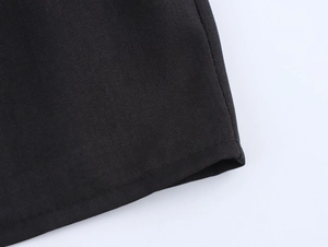 Close-up of black twill fabric texture and durable double-stitch sewing details