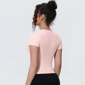 Rear side view of a pink slim-fit yoga t-shirt showing the athletic silhouette and fabric