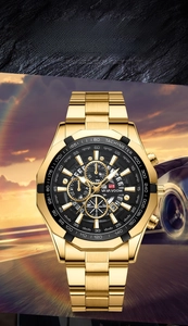 Detailed close-up of golden stainless steel chronograph watch with black tachymeter dial