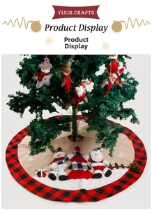 Detail of red and black buffalo plaid Christmas tree skirt with plush snowman embroidery