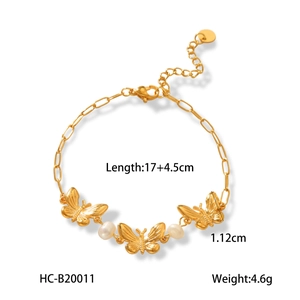 Détail du bracelet papillon et perle en acier doré 18K avec dimensions du bijou