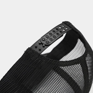 Adjustable snapback closure and breathable black mesh detail on a vintage trucker cap