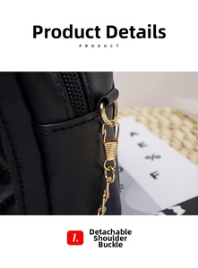 Detail shot of the gold metal buckle and chain strap on a black quilted leather handbag