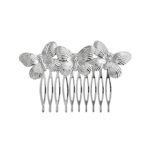 Detailed view of silver metal hair comb featuring three butterfly ornaments on white background