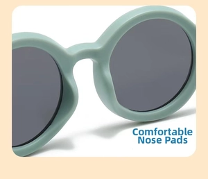 Detail of mint green baby sunglasses featuring soft integrated nose pads for comfort