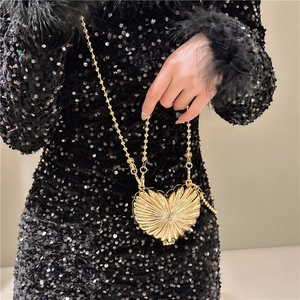 Chic gold heart-shaped metal clutch bag with pleated texture and beaded chain strap