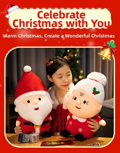 Close-up of model holding soft plush Santa and Mrs. Claus dolls in festive red and white