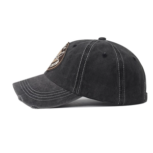 Washed dark grey baseball cap with eagle embroidery and distressed brim detail