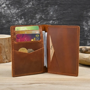 Detail view of the vintage brown leather wallet interior showing card slots and coin pocket