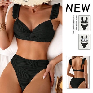 Detail of black textured high-waisted bikini featuring ruffle straps and V-neck twist front