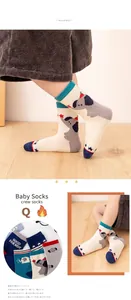 Detail of mesh baby socks with blue cartoon elephant and red star patterns in soft cotton