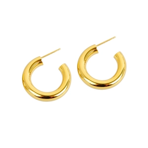 Minimalist chunky gold C-shaped hoop earrings with a high-polished metallic finish