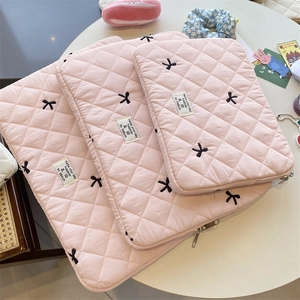 Pink quilted laptop sleeve with cute bow embroidery, protective case for 11 13 15 inch tablets.