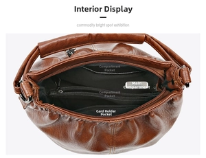 Detailed view of the brown wrinkled leather bag interior with multiple compartments