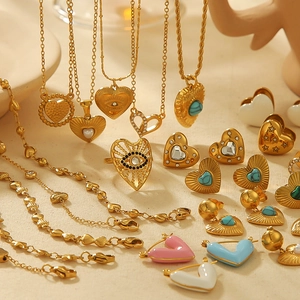 Golden heart and evil eye jewelry set with turquoise and colorful enamel stones