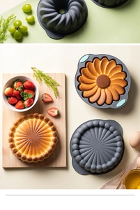 Flat lay of gray sunflower silicone cake molds with baked goods and fresh baking ingredients