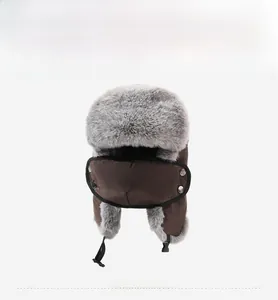 Detailed view of winter trapper hat with detachable face mask and faux fur lining