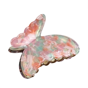 Elegant butterfly hair claw in pearlescent pink and green marble acetate hair accessory