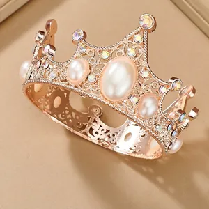 Exquisite golden crown with white pearls and colorful rhinestones for birthday celebrations