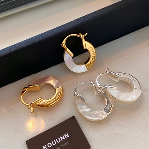 Minimalist metal hoop earrings with white mother-of-pearl inlay and Confession engraving