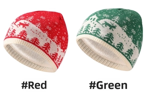 Detail view of winter knitted reindeer hats with plush lining in red and green colors