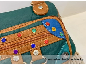 Close-up of vibrant multicolored rhinestones and textured leather patchwork on the bag