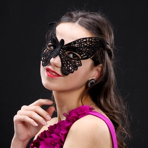 Elegant black lace butterfly mask for masquerade events worn by a smiling model