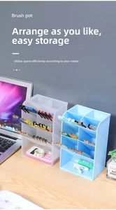 Close-up of translucent desktop organizer showing four-grid slanted slot design
