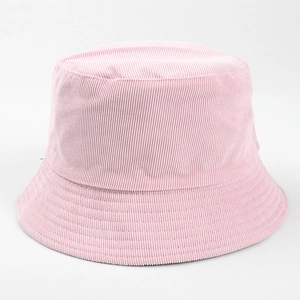 Close-up detail of the ribbed corduroy fabric on a stylish pink casual bucket hat