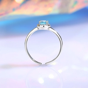 Elegant S925 sterling silver ring with light blue round gemstone and halo diamonds