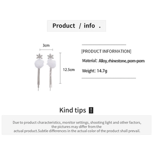 Detail view of snowflake earrings showing 3cm width and 12.5cm height measurements