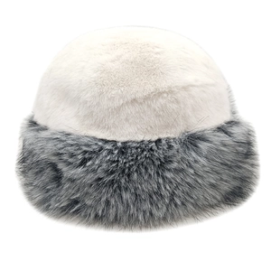 Close-up of plush faux fur bucket hat with cream top and textured grey brim detail