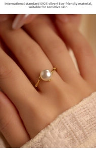 Detailed close-up of S925 silver bamboo-style ring with a round white pearl on hand