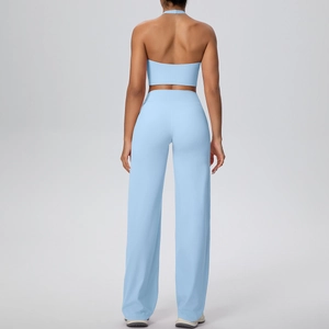 Light blue halter sports bra and high-waisted wide-leg yoga pants set back view