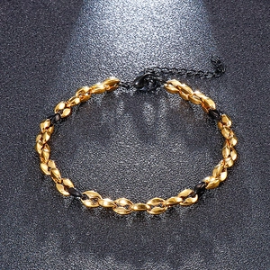 Two-tone gold and black titanium link bracelet with lobster clasp and extension chain