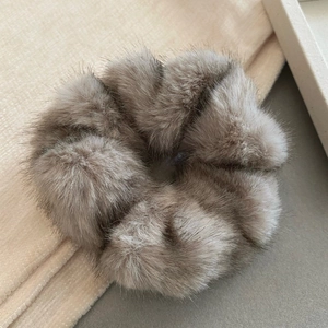 Plush faux mink fur scrunchie in taupe, elegant oversized hair tie for autumn and winter